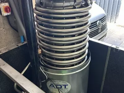 New boiler coil being installed into industrial hot pressure washer during emergency repair in Atherstone.